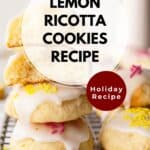 Lemony Ricotta Cookies piled up like a tower with two at the top broken in half.