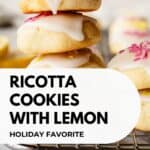 Lemony Ricotta Cookies piled up like a tower with two at the top broken in half.