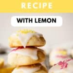 Lemony Ricotta Cookies piled up like a tower with two at the top broken in half.