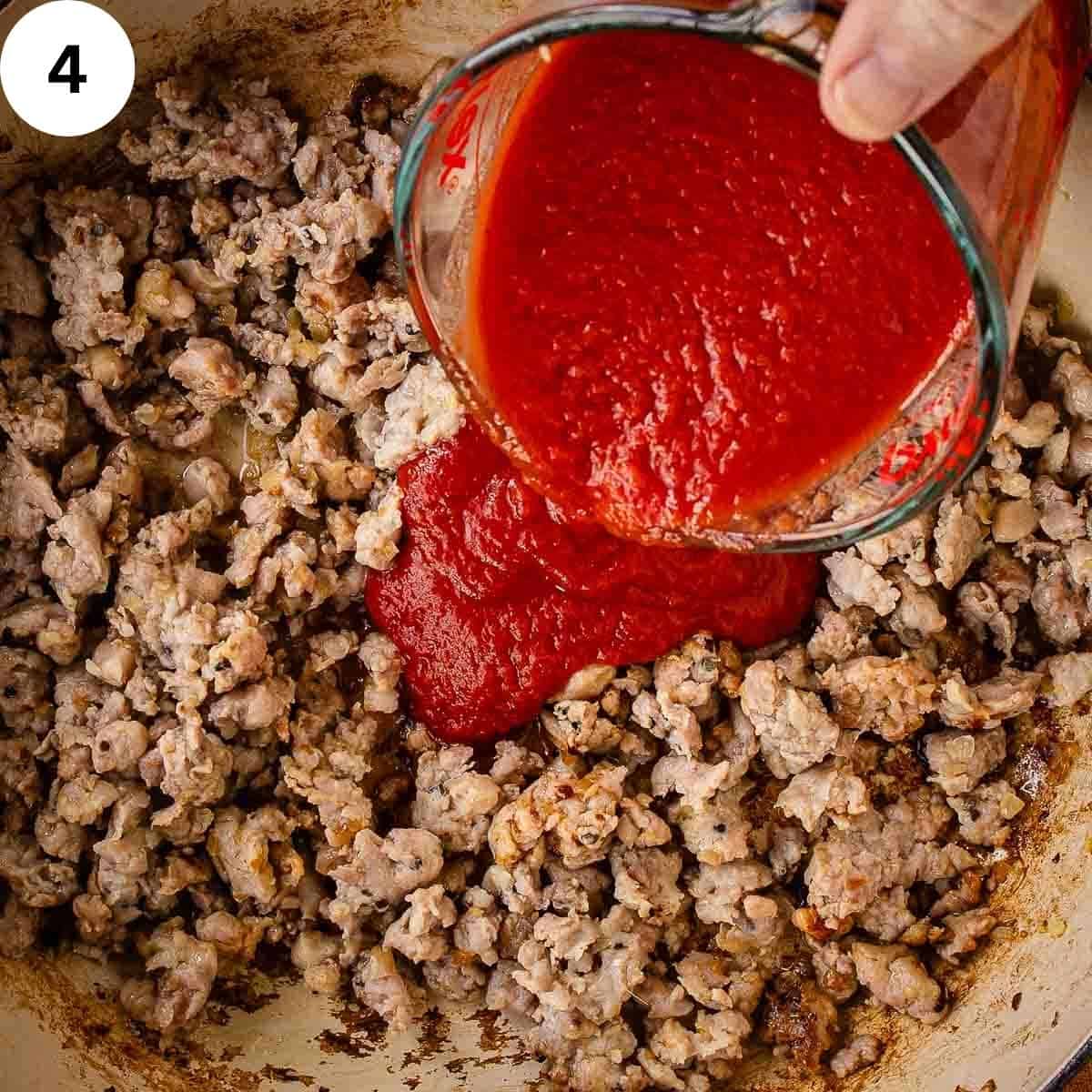 Pouring tomato puree into browned meat.