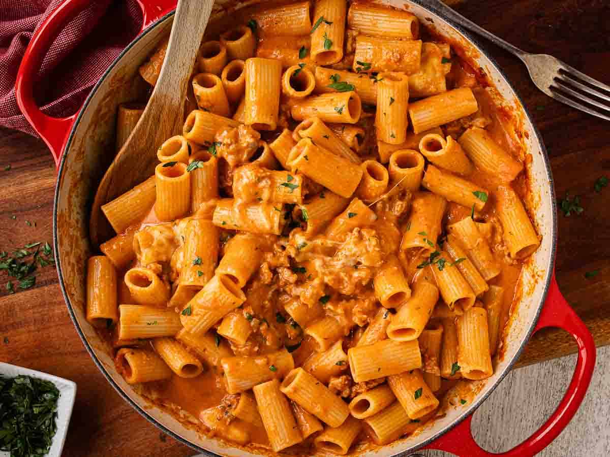 Overhead view of rigatoni pasta with a creamy tomato sauce.