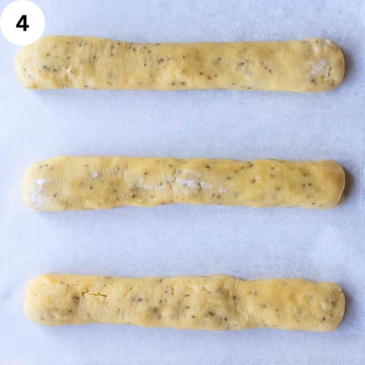 Three logs of dough.