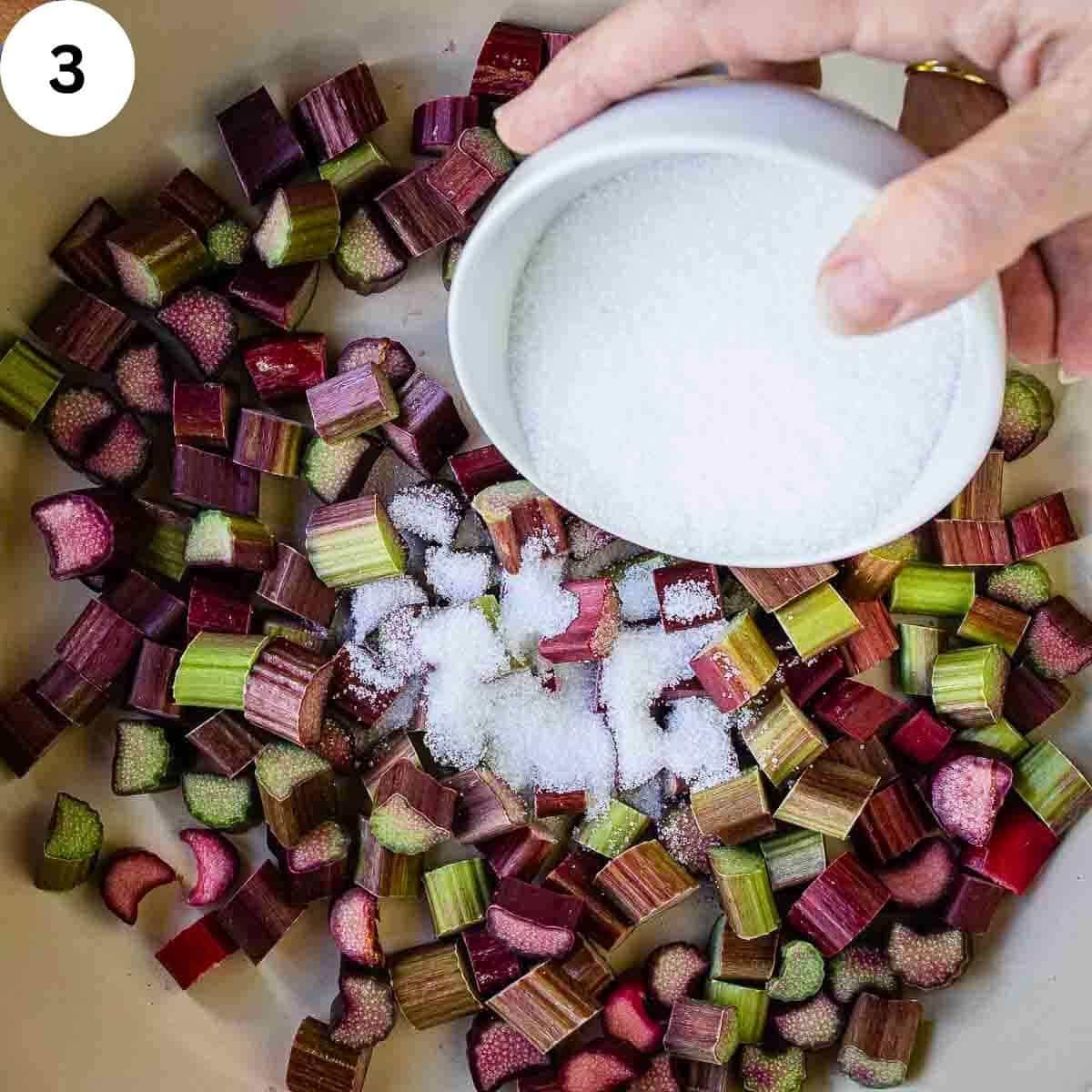 Adding sugar to sliced rhubarb.
