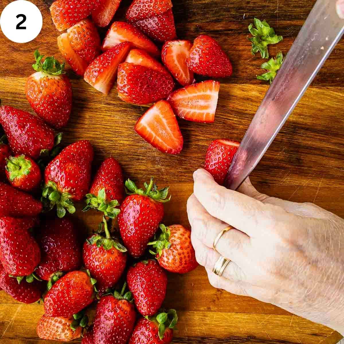 Cutting fresh strawberries.