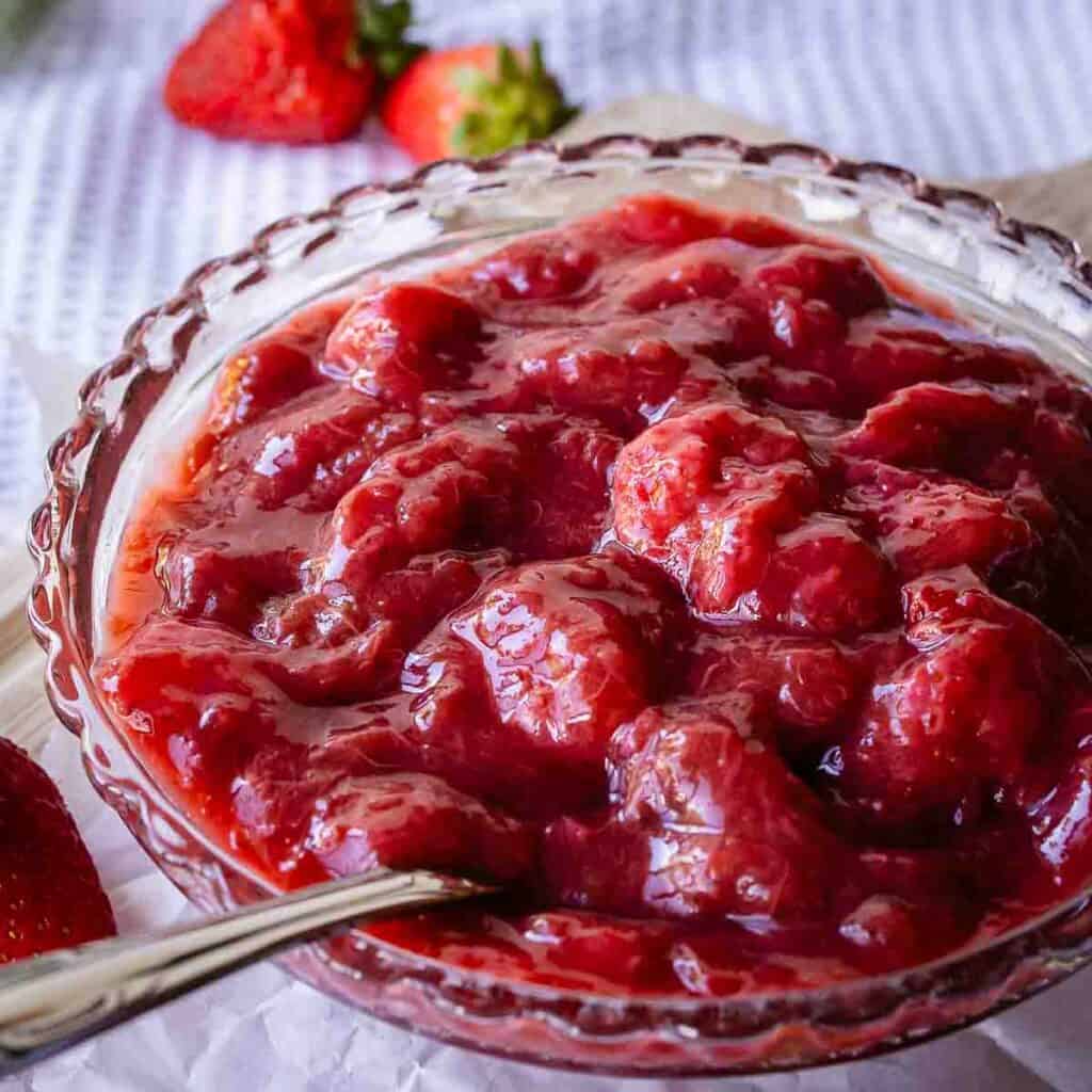 Strawberry rhubarb compote in a glass dish.