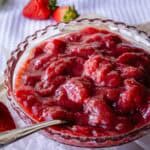 Strawberry rhubarb compote in a glass dish.