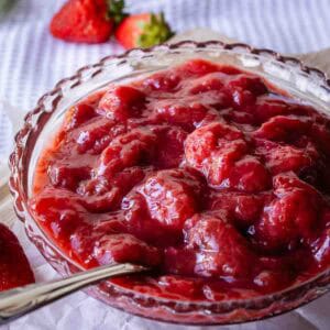 Strawberry rhubarb compote in a glass dish.