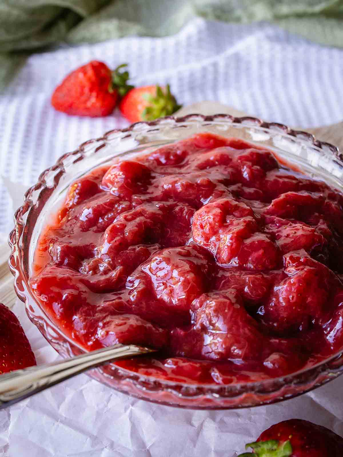 Strawberry rhubarb compote in a glass dish.