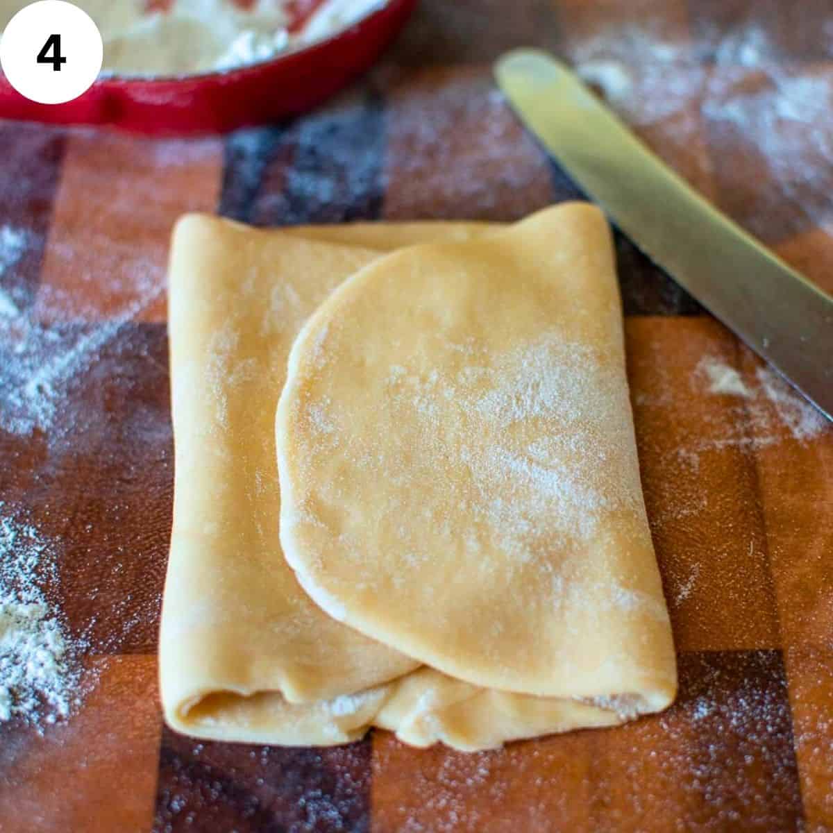 Pasta dough rolled and folded into thirds.