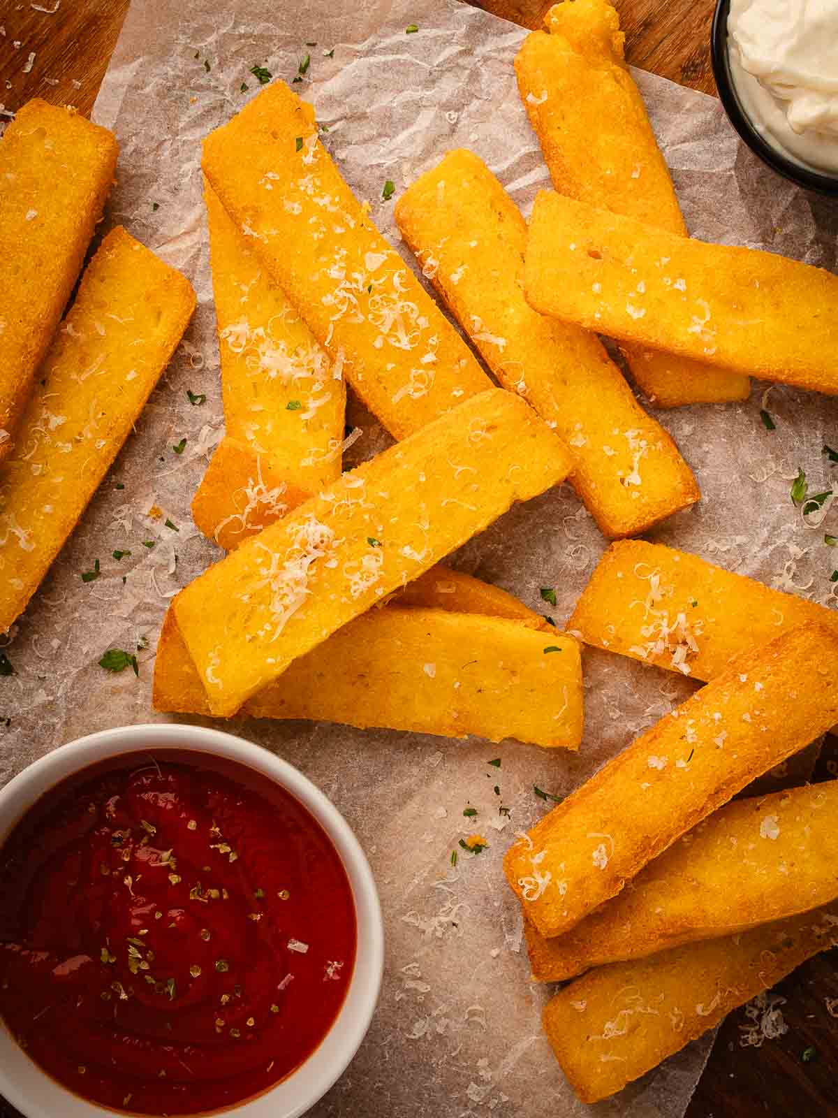 Overhead view of golden stick of polenta fritta.