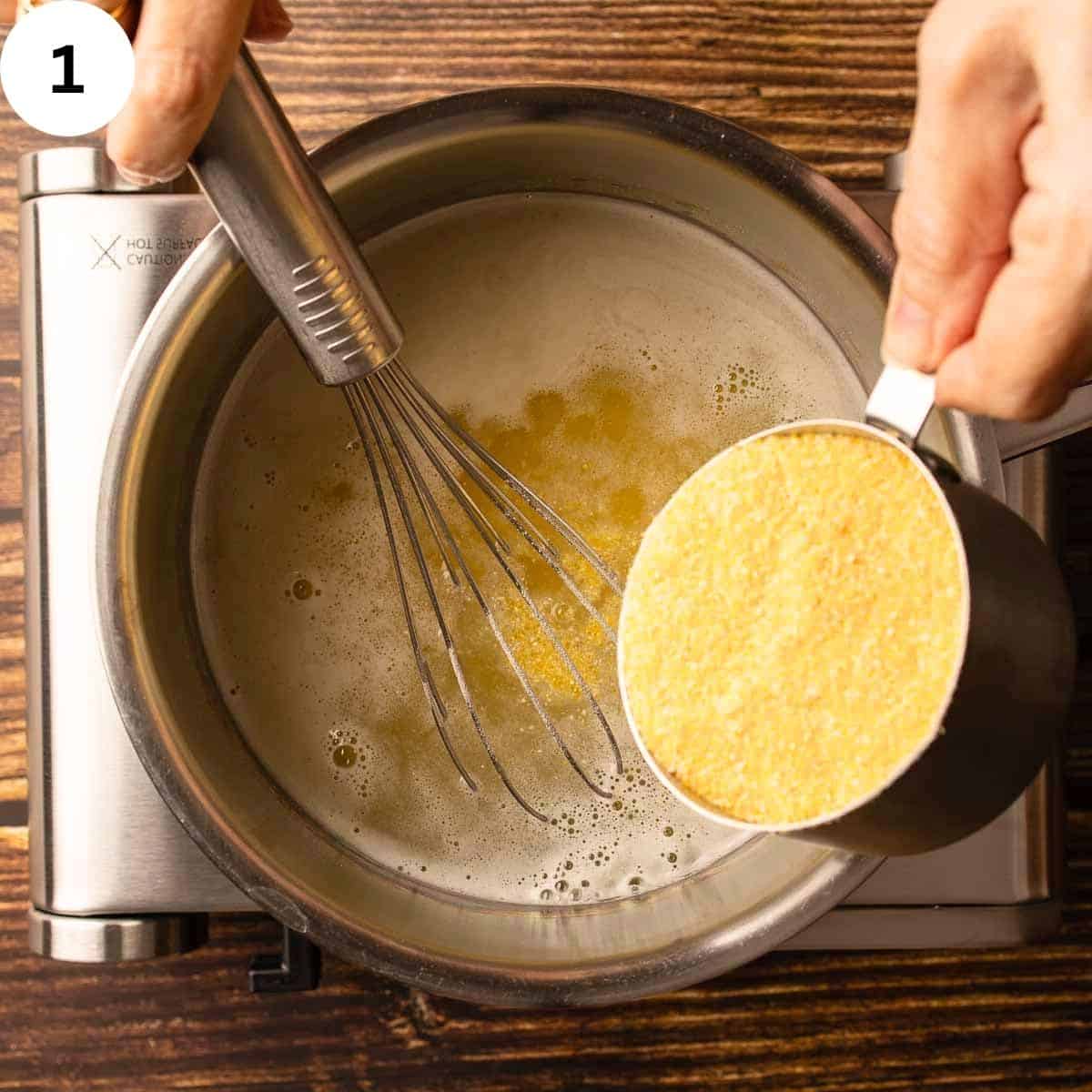 Adding polenta cornmeal to boiling water.
