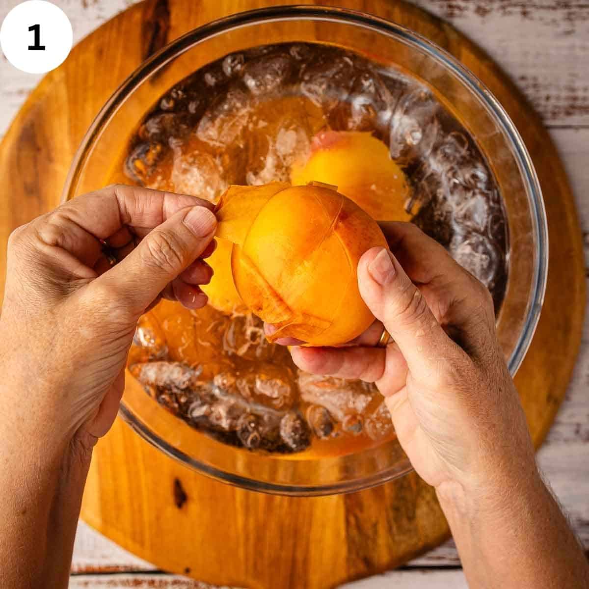 Taking the skin off a blanched fresh peach.