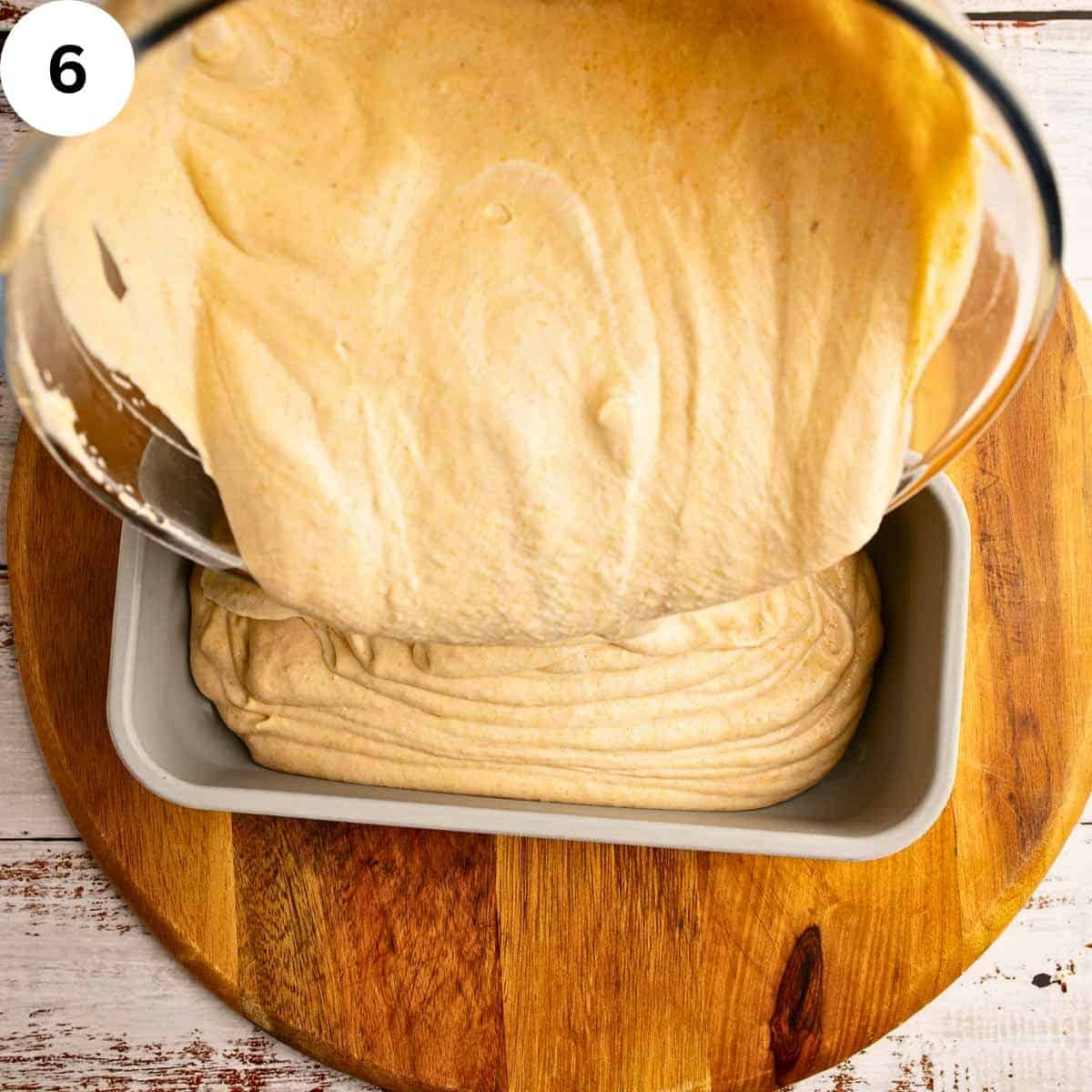 Pouring no churn ice cream into a loaf pan.
