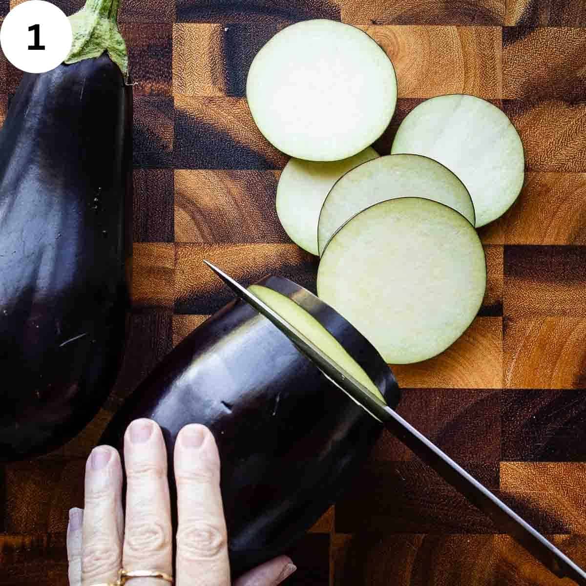 Slicing eggplants on a wooden board.