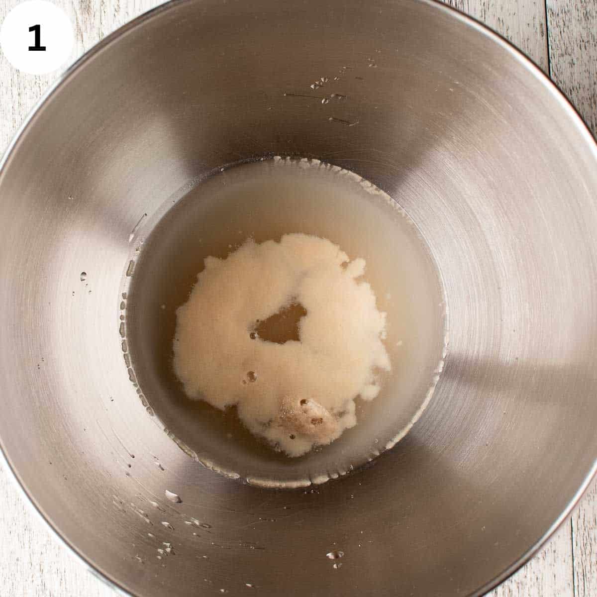 Active dried yeast and water blooming and frothing in a bowl.